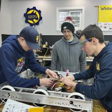 Students working on robot chassis